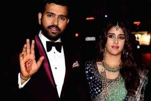 Rohit Sharma tries to impress his wife Ritika by putting henna on his hand