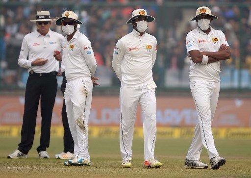 Lanka go behind pollution masks after Kohli's record double