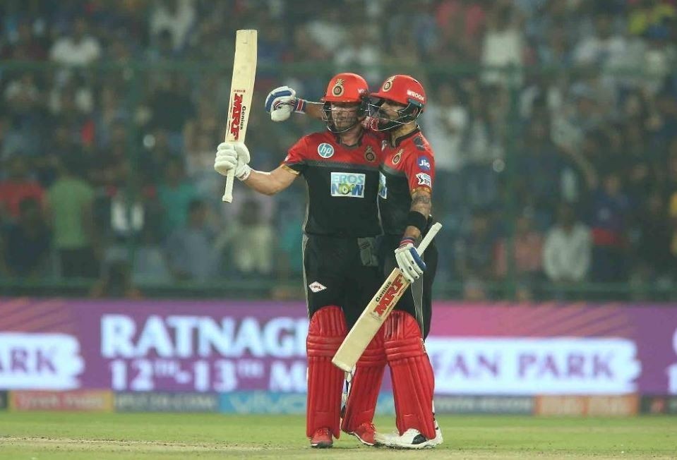 rcb fight for survival against down and out delhi Kohli, de Villiers propel RCB to 5-wicket victory over DD