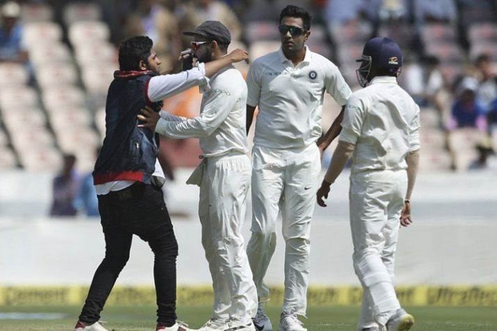 india vs west indies 2nd test day 1 fan breaches security tries to kiss virat kohli during live match Fan breaches security, tries to kiss Virat Kohli during live match