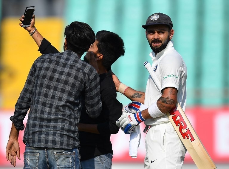 streakers selfie with kohli interrupts play on day 1 Ind vs WI: Streakers 'selfie with Kohli' interrupts play on Day 1