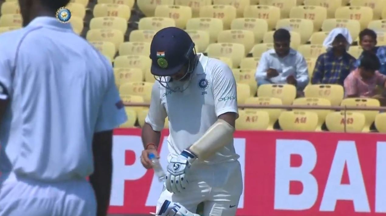 No need for a drinks trolley, Pujara carries one inside his pocket