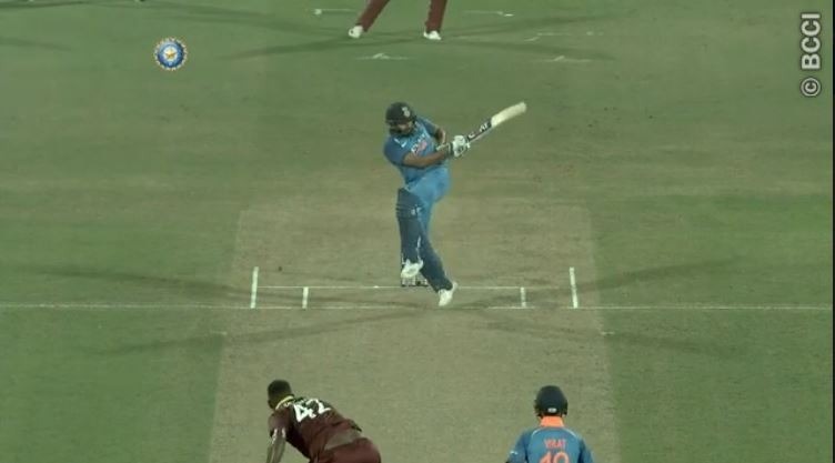 watch rohit sharma hits maximum on one leg to debutant oshane thomas WATCH: Rohit Sharma hits maximum on one leg to debutant Oshane Thomas