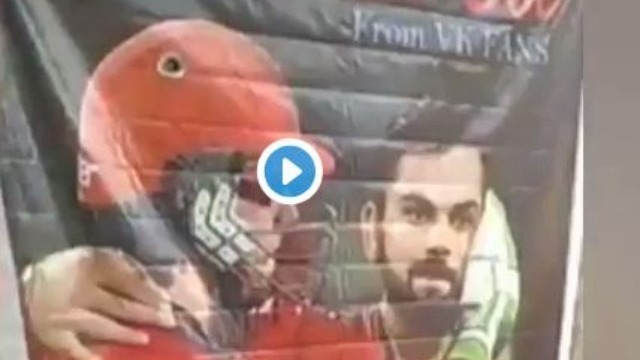 watch rcb fans shower milk on virat kohli ab de villiers poster WATCH: RCB fans shower milk on Virat Kohli-AB de Villiers' poster