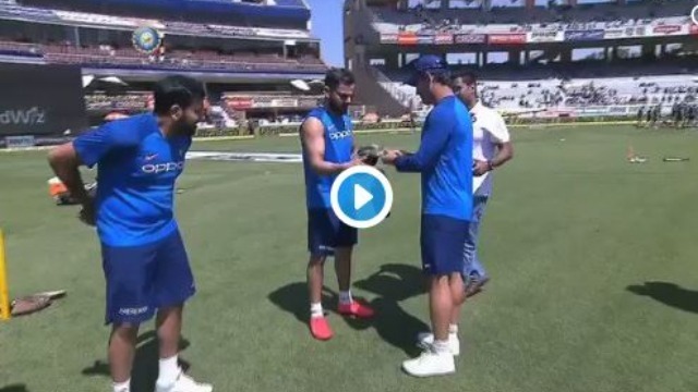 watch lt col dhoni presents camouflage cap to team india pays tribute to armed forces WATCH: Lt Col Dhoni presents camouflage caps to Team India players to honour Pulwama martyrs