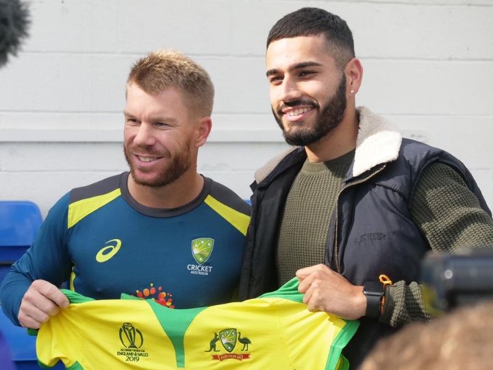 world cup 2019 warner gifts signed australia jersey to indian origin bowler he hit at nets WATCH: Warner gifts signed Australia jersey to Indian-origin bowler he hit at nets