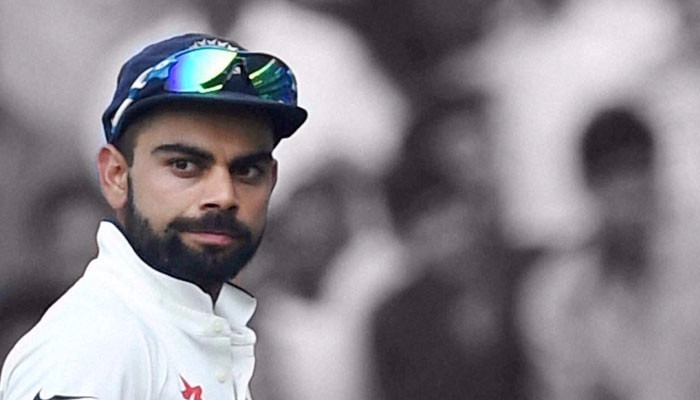 captain virat caught chewing gum during national anthem before india and sl test series opener in kolkata भारतीय कप्तान विराट कोहली ने किया राष्ट्रगान का 'अपमान'