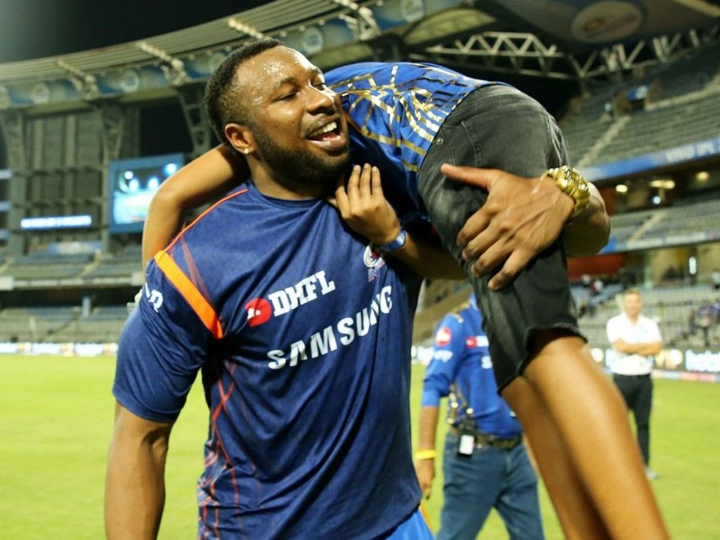 ipl 2019 senior and junior pollard says mommy this win is your bday gift IPL 2019 MI vs KXIP: पोलार्ड ने बेटे के साथ मनाया जीत का जश्न, पत्नी को दिया बर्थडे गिफ्ट